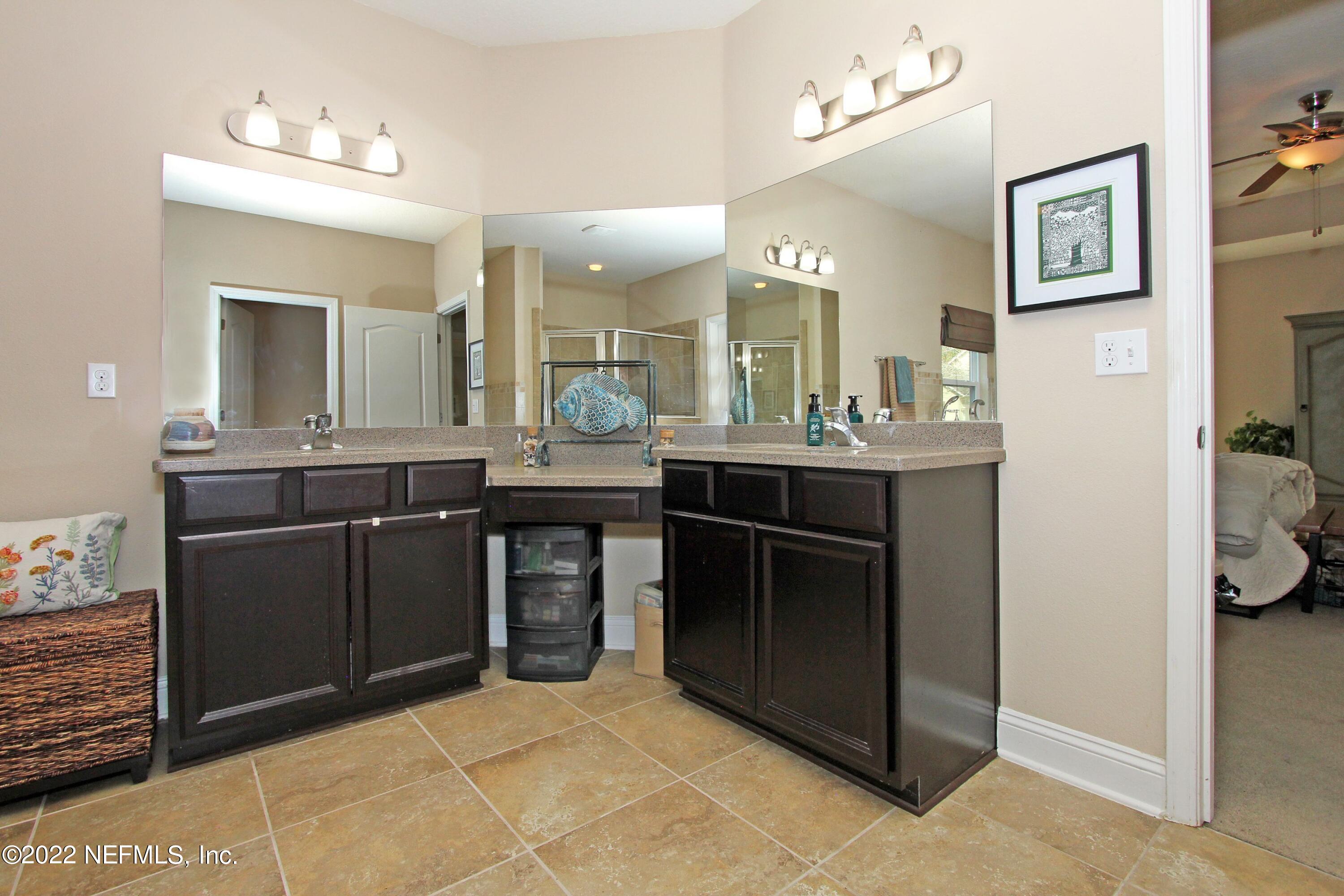 404 Paisley Place St. Johns, FL 32259 - Photo 26 of 42 a kitchen with stainless steel appliances granite countertop a sink and cabinets