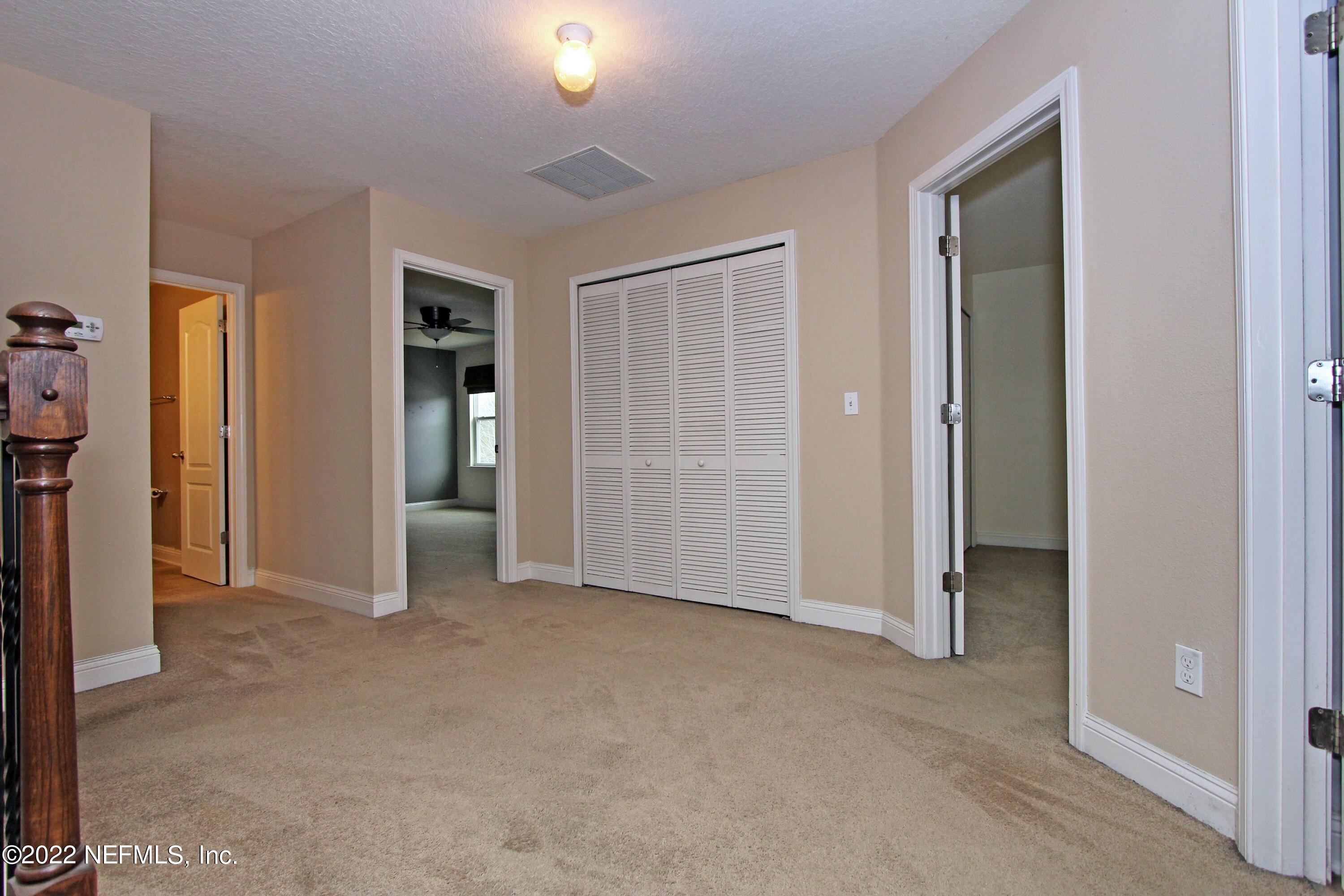 404 Paisley Place St. Johns, FL 32259 - Photo 30 of 42 an empty room with closet and a bathroom