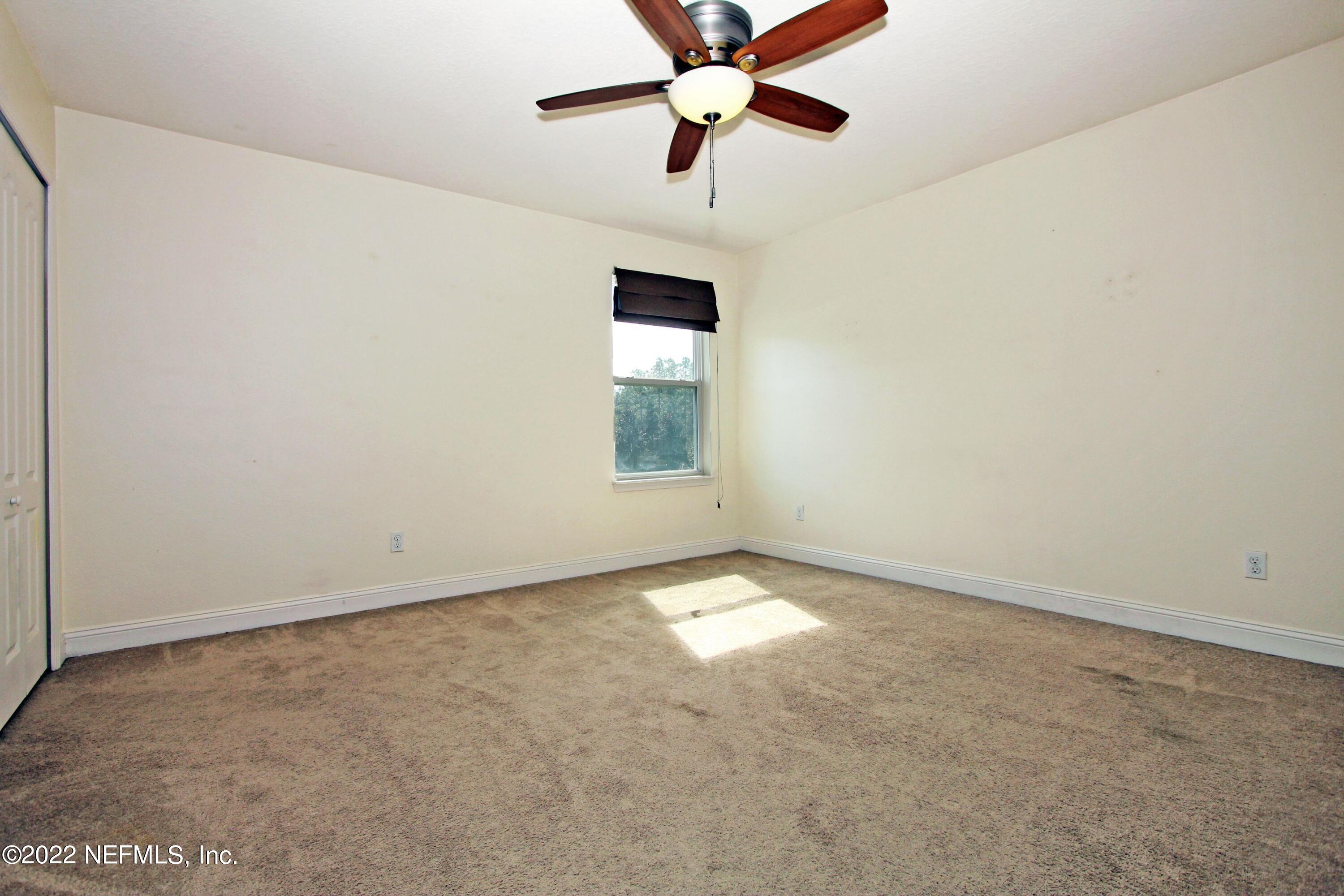404 Paisley Place St. Johns, FL 32259 - Photo 31 of 42 an empty room with windows and fan