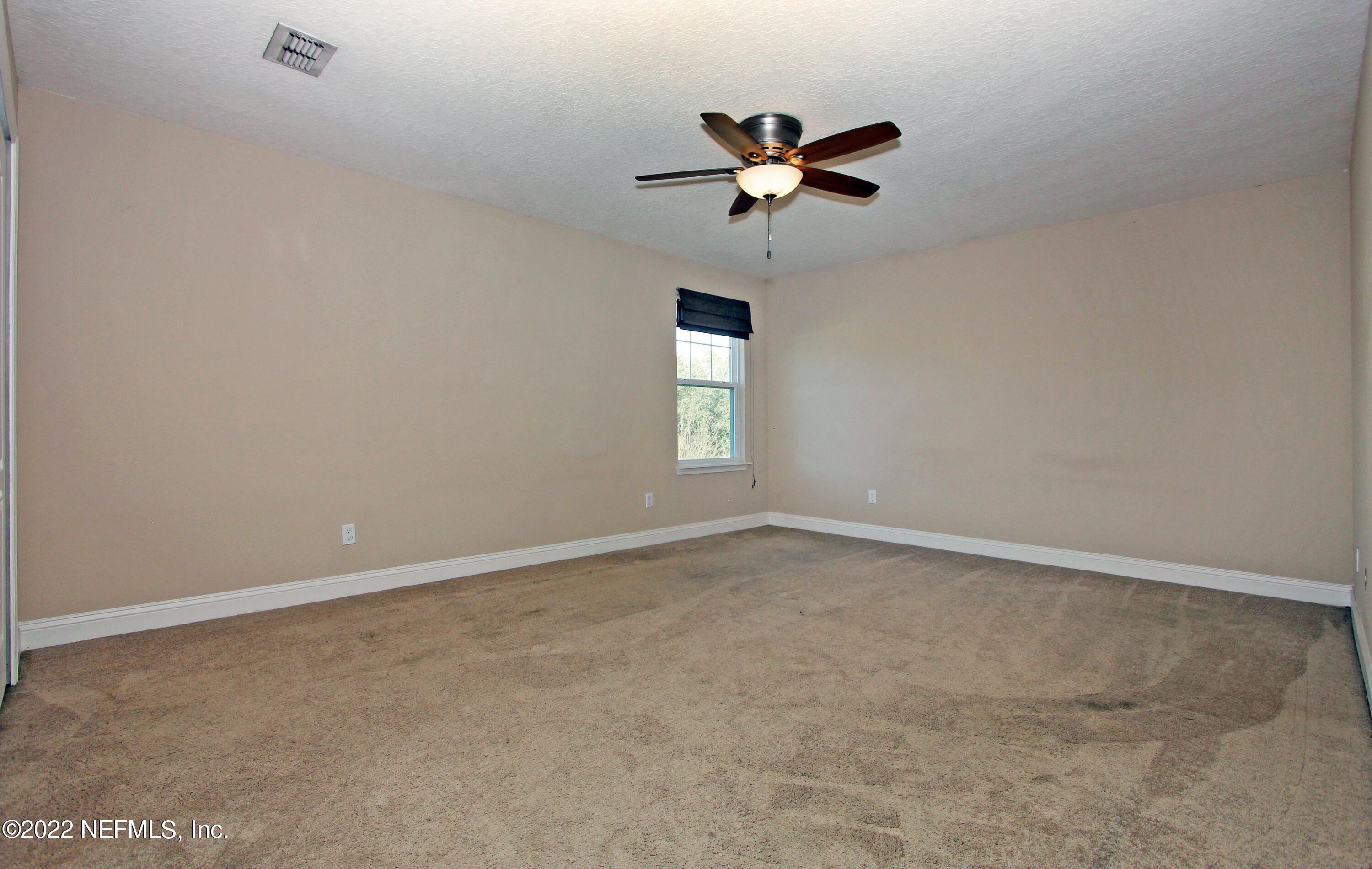 404 Paisley Place St. Johns, FL 32259 - Photo 33 of 42 a view of an empty room with a window