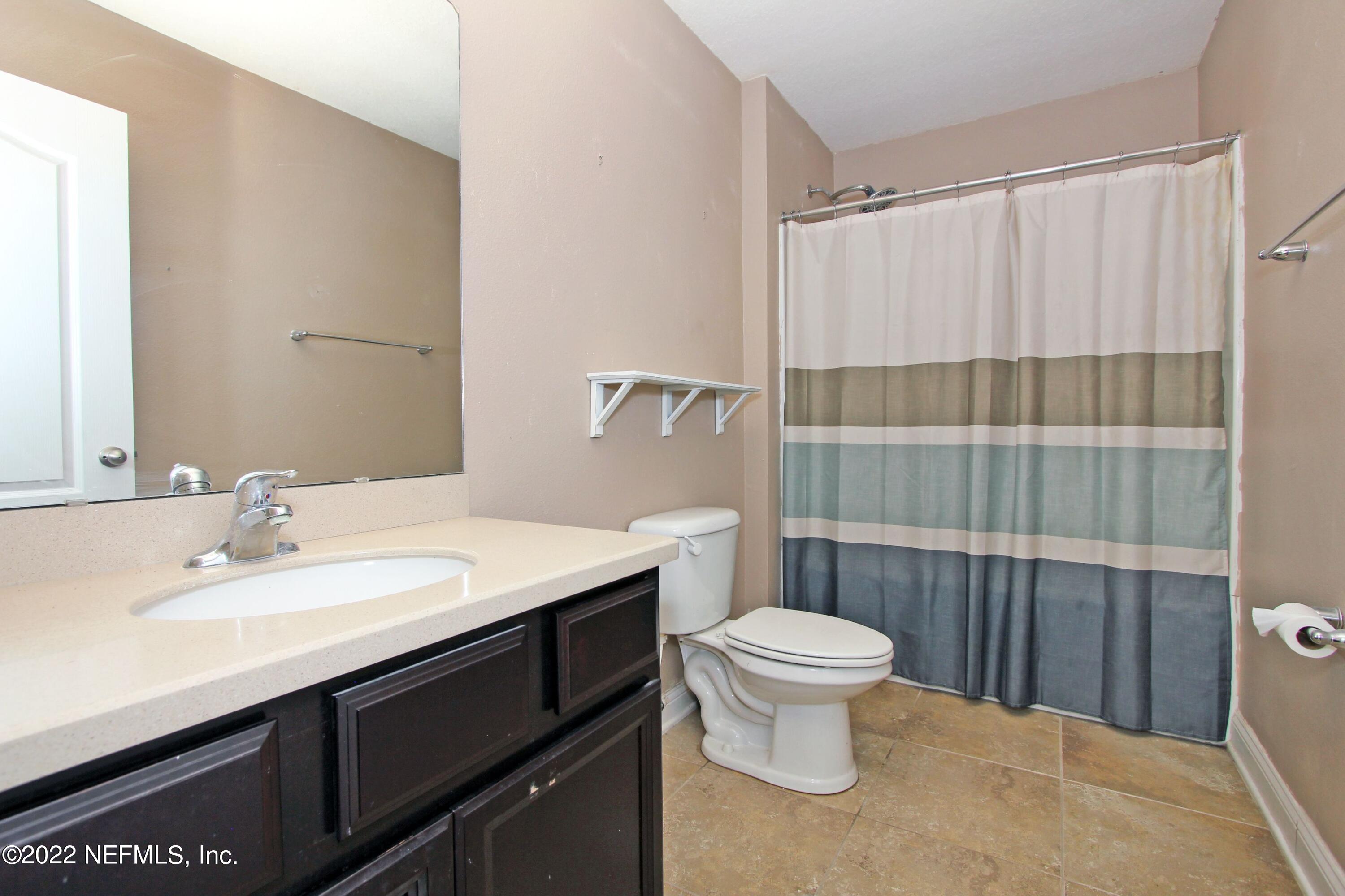 404 Paisley Place St. Johns, FL 32259 - Photo 35 of 42 a bathroom with a sink toilet and shower