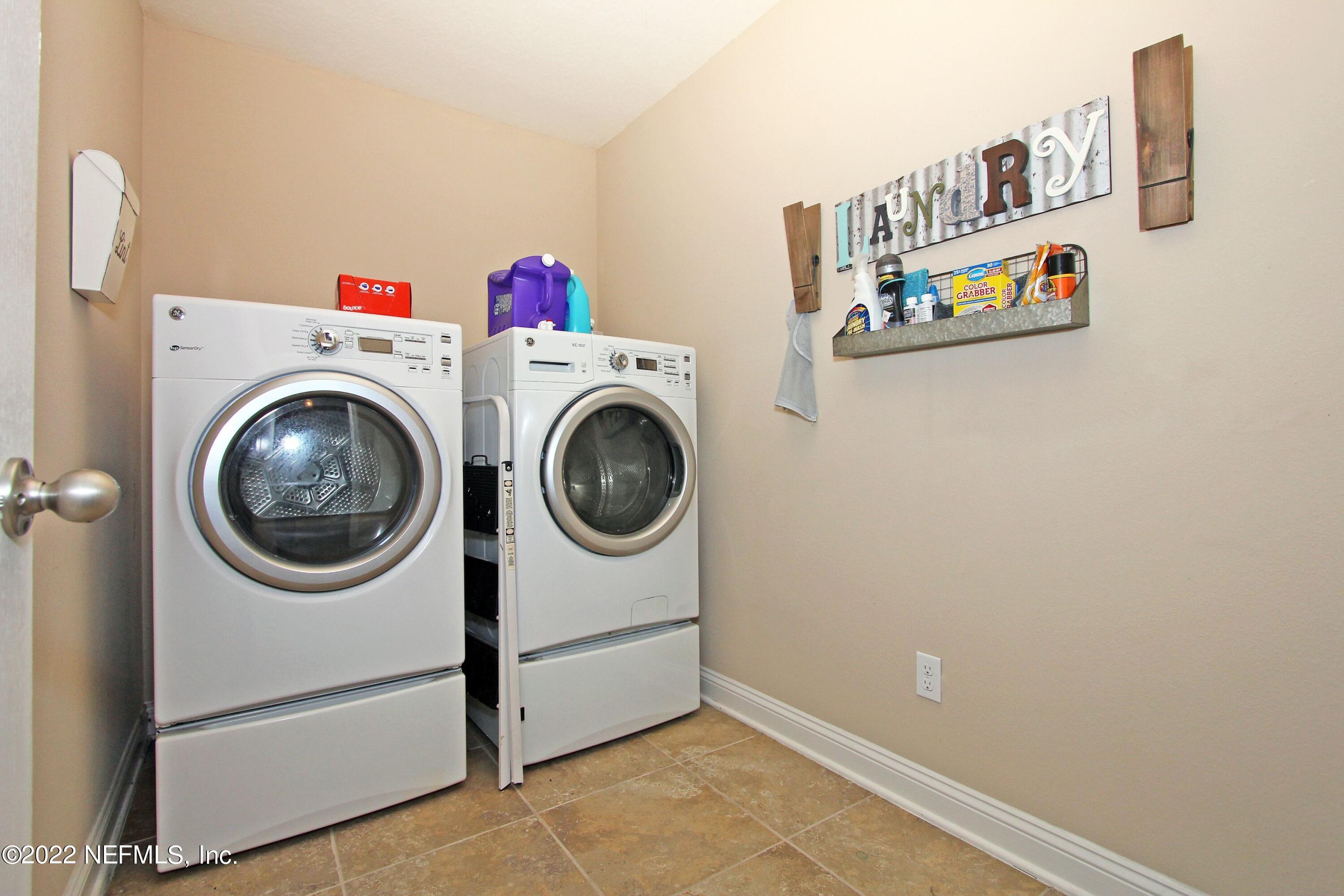 404 Paisley Place St. Johns, FL 32259 - Photo 36 of 42 a utility room with dryer and washer