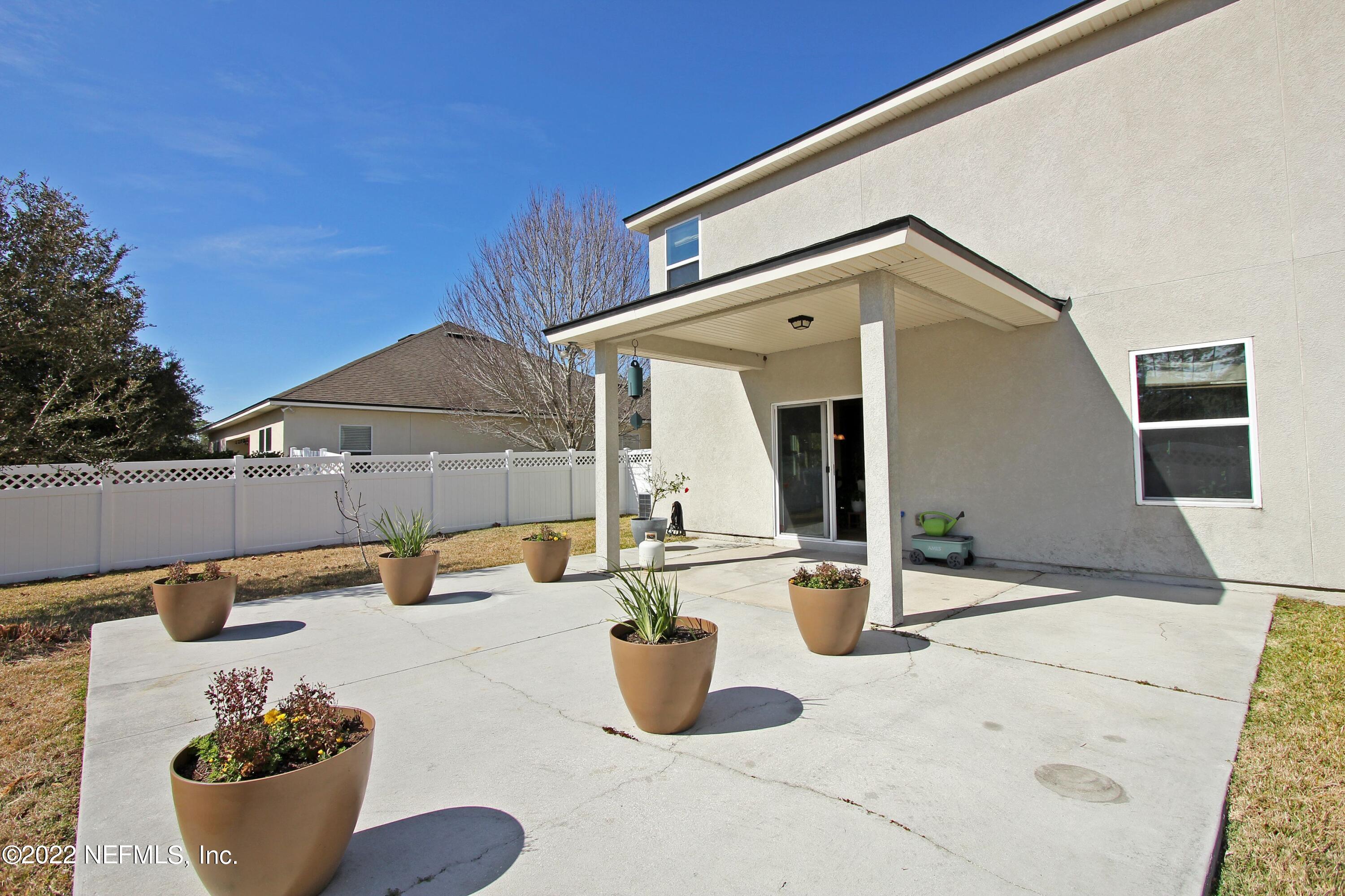 404 Paisley Place St. Johns, FL 32259 - Photo 38 of 42 a front view of a house with patio