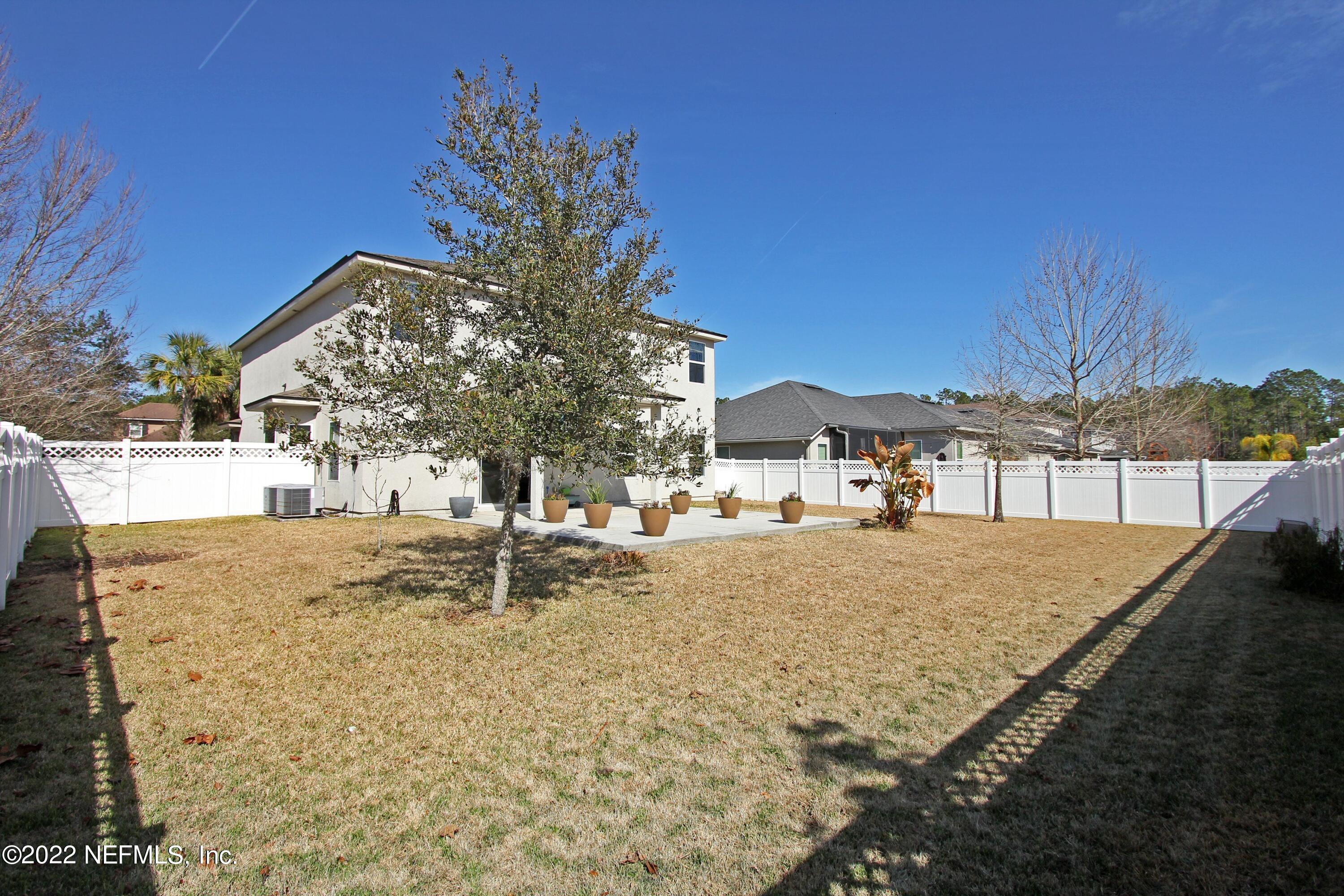 404 Paisley Place St. Johns, FL 32259 - Photo 40 of 42 a view of a yard covered in snow