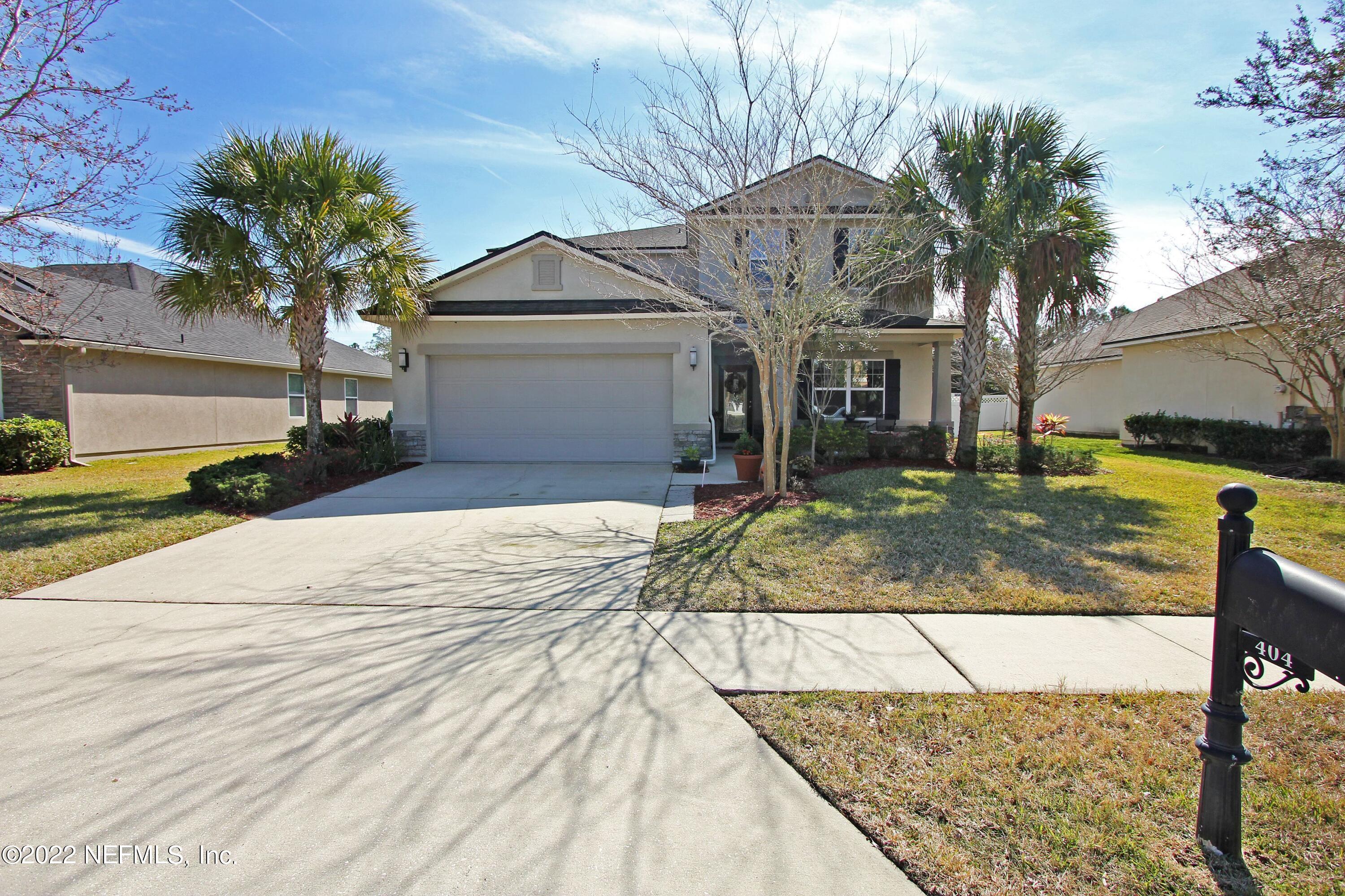 404 Paisley Place St. Johns, FL 32259 - Photo 4 of 42 a front view of a house with a yard