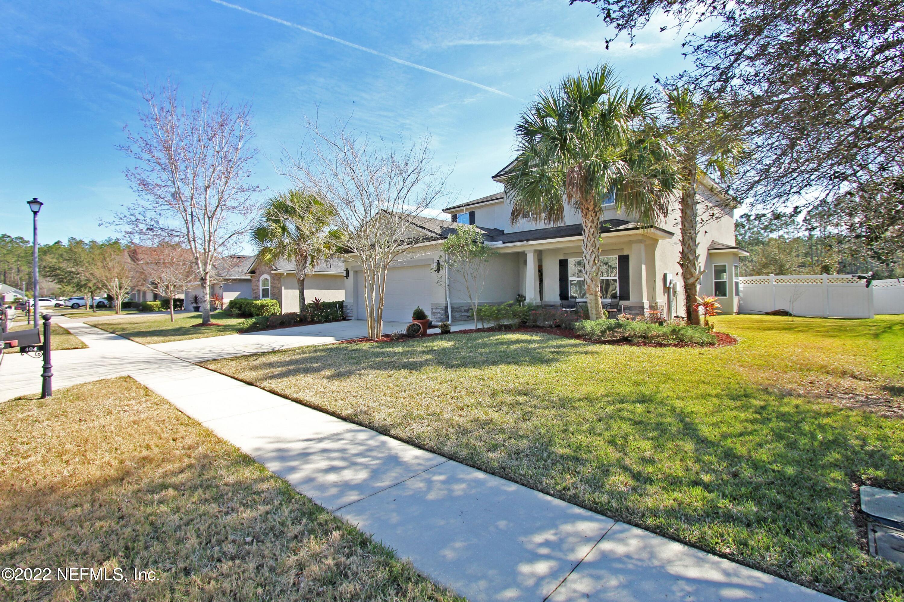 404 Paisley Place St. Johns, FL 32259 - Photo 6 of 42 a front view of a building with garden