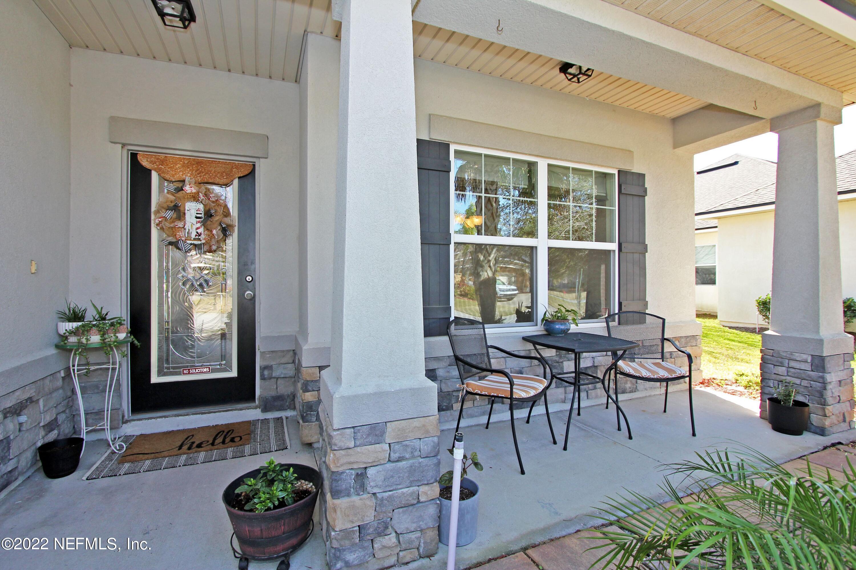 404 Paisley Place St. Johns, FL 32259 - Photo 7 of 42 a living room with furniture and a potted plant