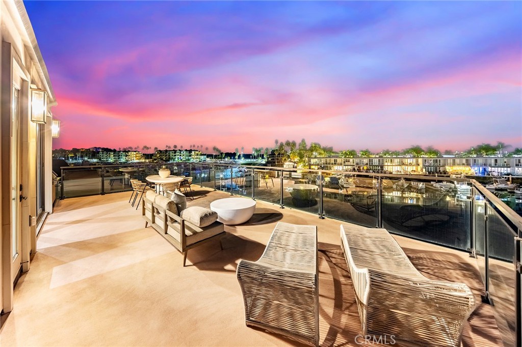 17007 Edgewater Lane Huntington Beach, CA 92649 - Photo 14 of 50 a view of a terrace with sitting area