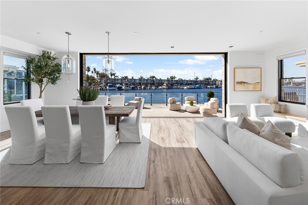 17007 Edgewater Lane Huntington Beach, CA 92649 - Photo 17 of 50 a living room with furniture a lamp and a large window