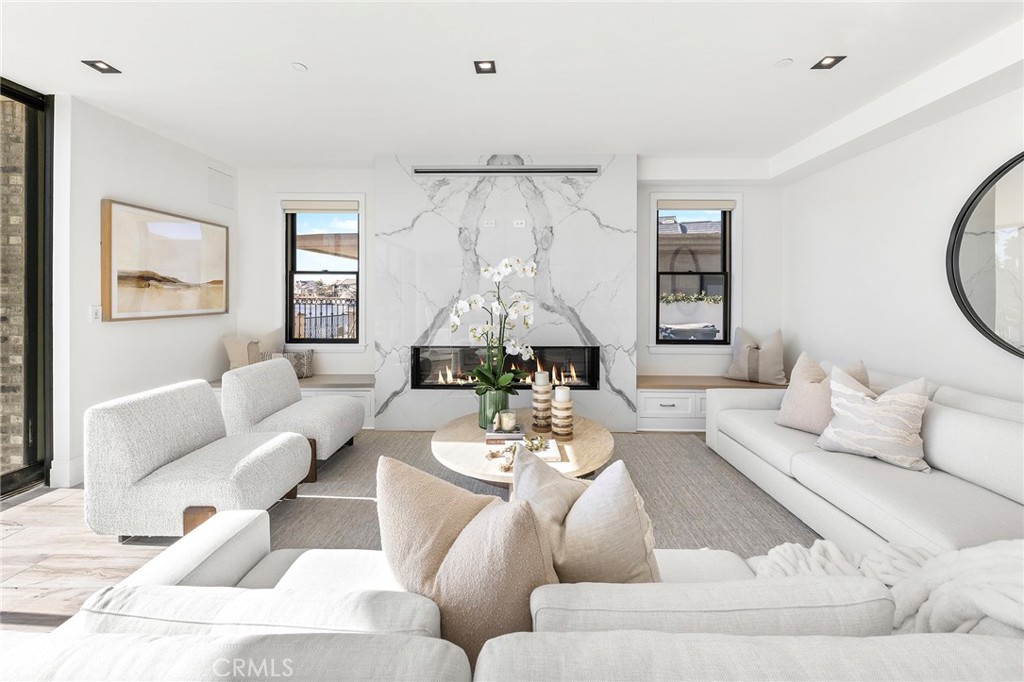 17007 Edgewater Lane Huntington Beach, CA 92649 - Photo 19 of 50 a living room with furniture and a large window