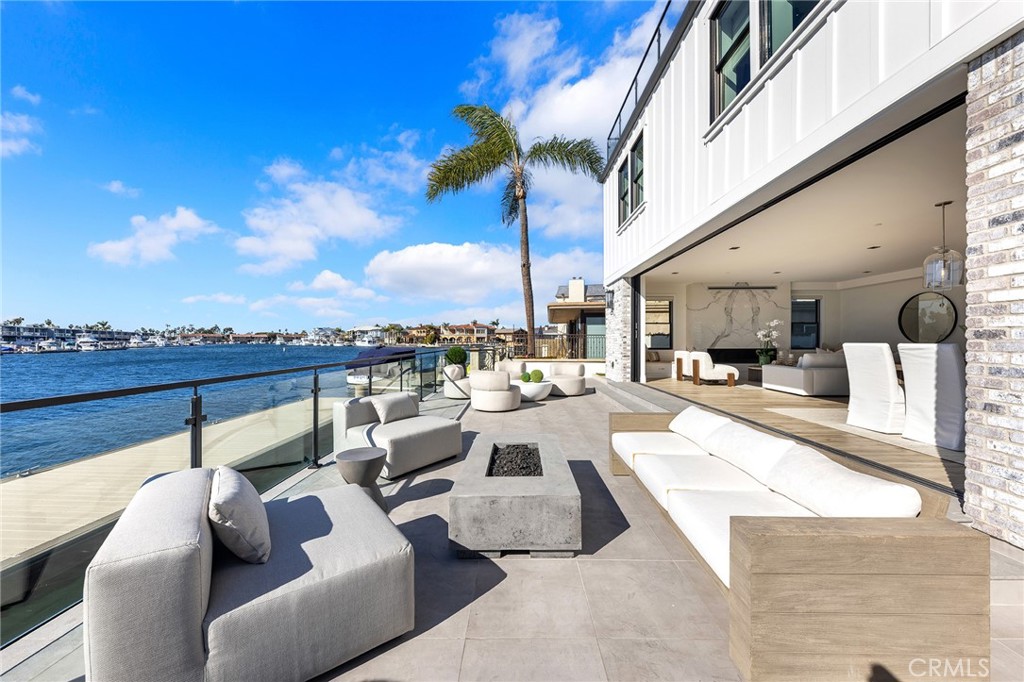 17007 Edgewater Lane Huntington Beach, CA 92649 - Photo 36 of 50 a view of a patio with couches and chairs