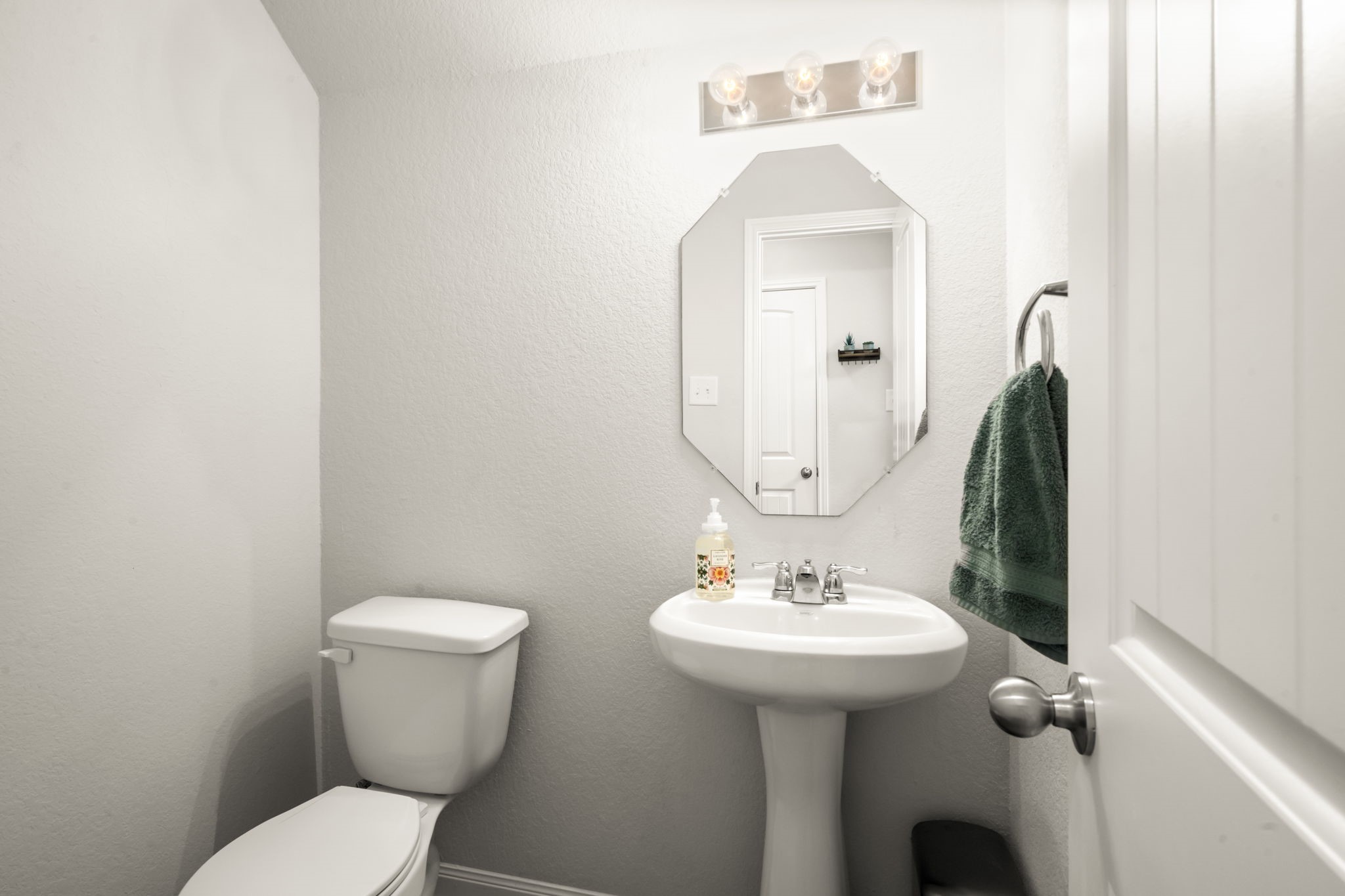 4915 Blue Jacaranda Way Spring, TX 77373 - Photo 13 of 30 Powder bath with pedestal sink and elongated toilet.
