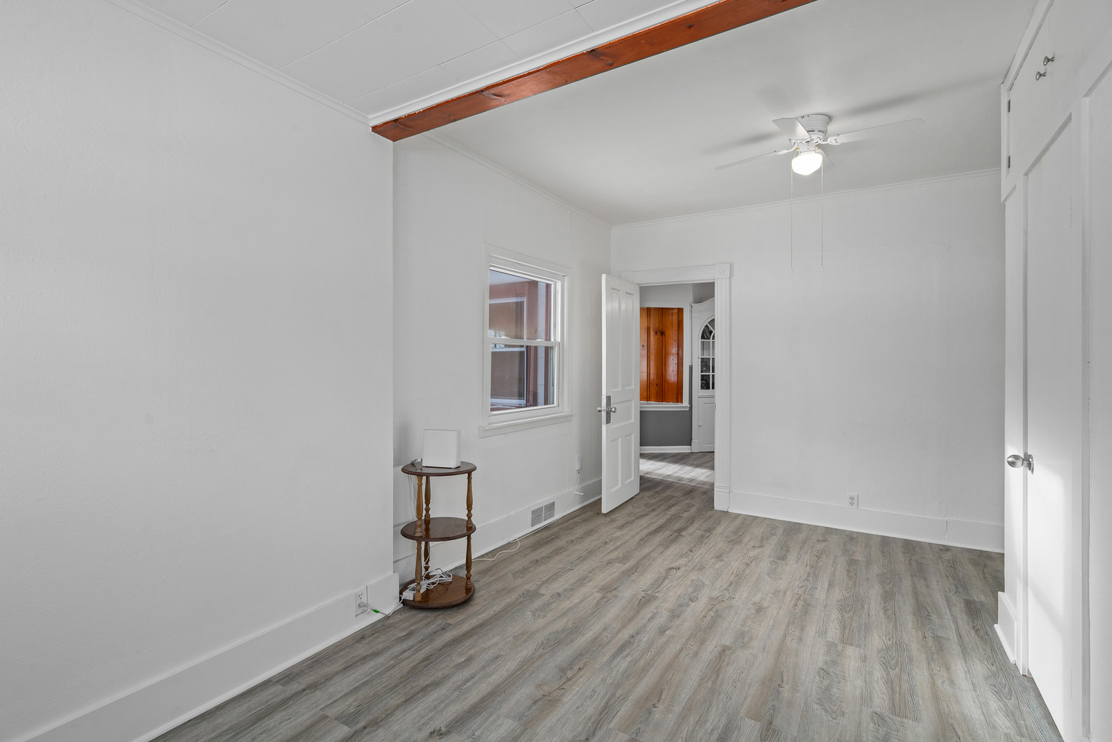 501 South Hamilton Street Lockport, IL 60441 - Photo 11 of 45 a view of an empty room with wooden floor and a window