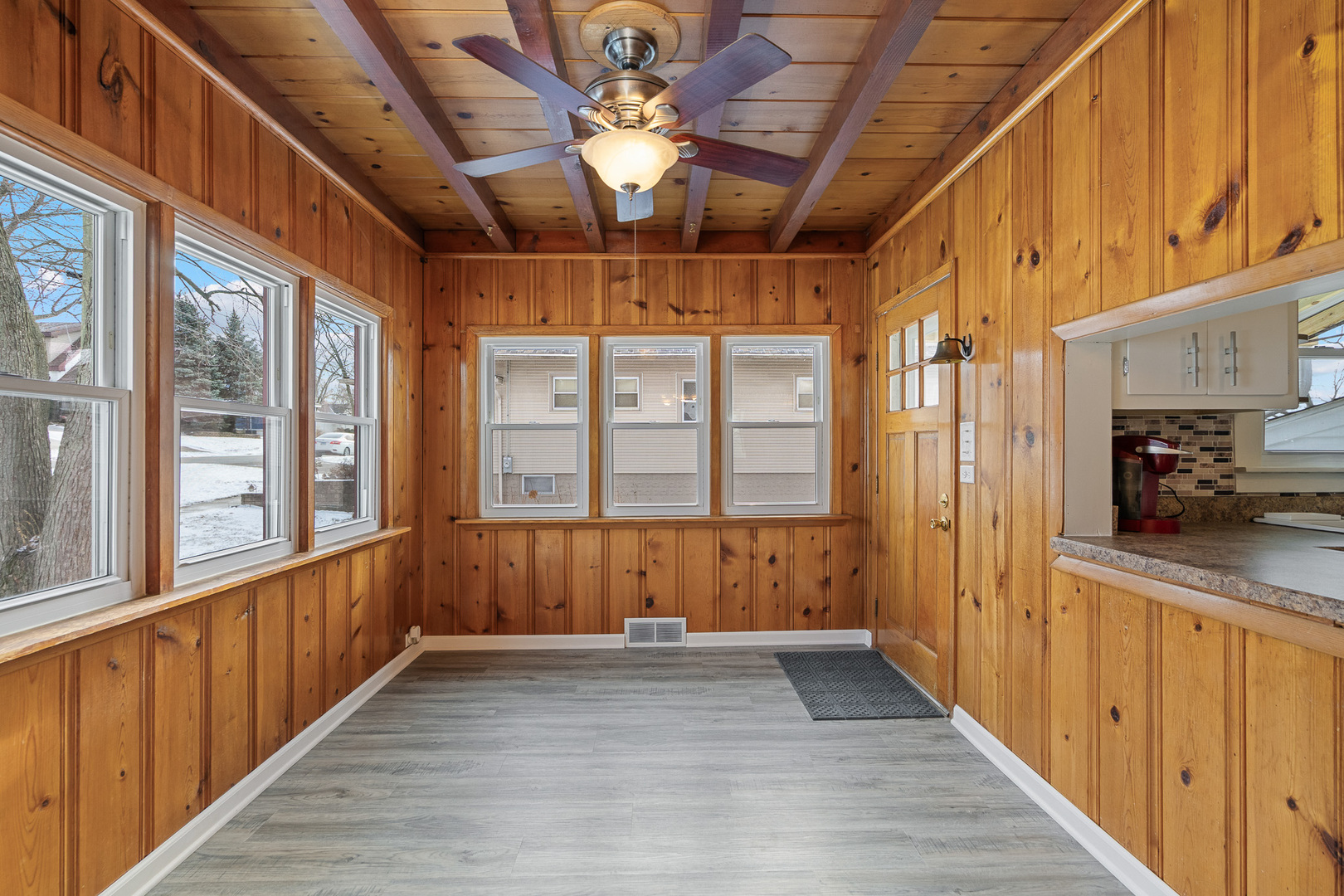 501 South Hamilton Street Lockport, IL 60441 - Photo 12 of 45 a view of a porch with wooden floor and furniture