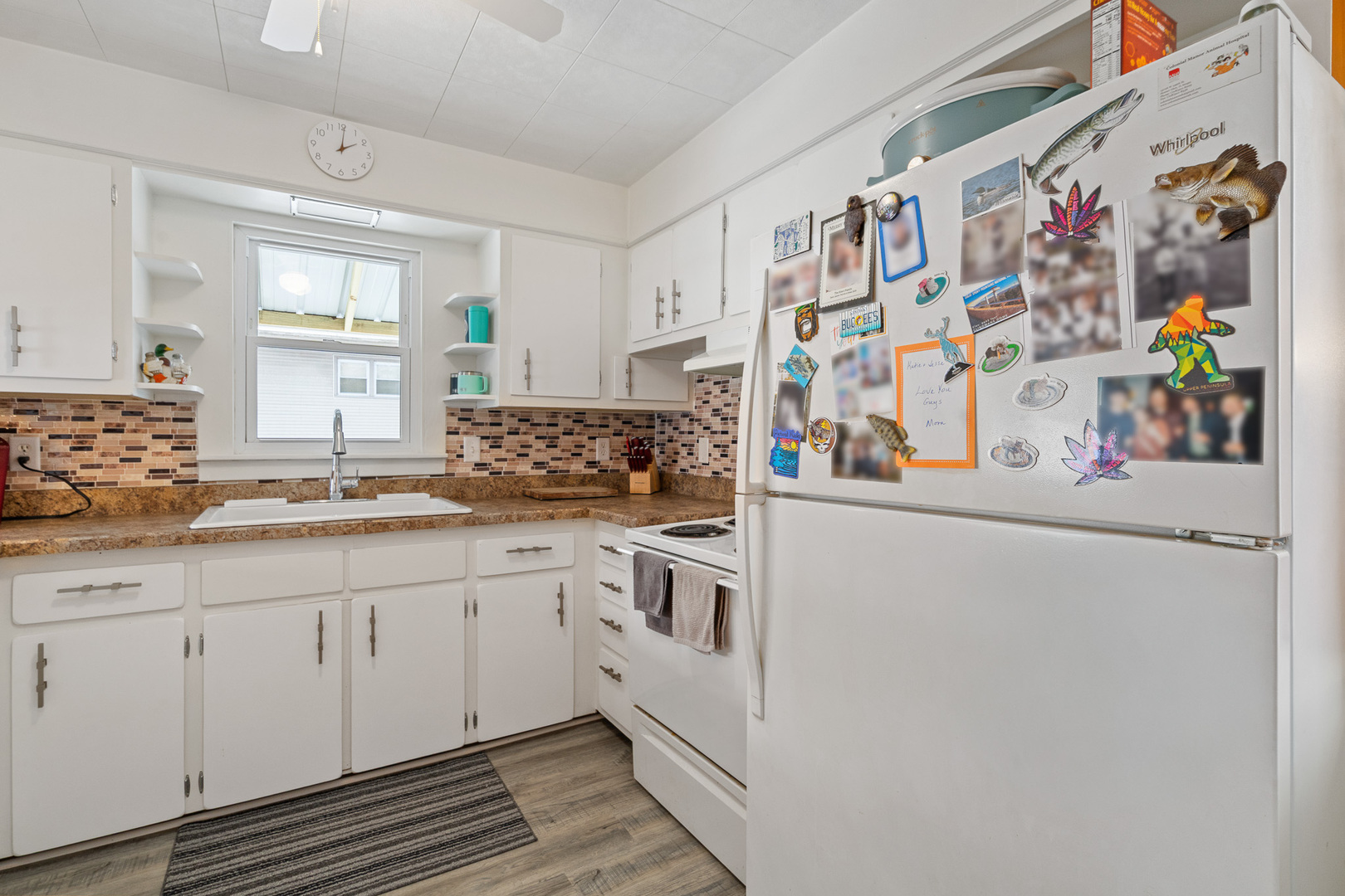 501 South Hamilton Street Lockport, IL 60441 - Photo 19 of 45 a kitchen with stainless steel appliances a sink and a refrigerator