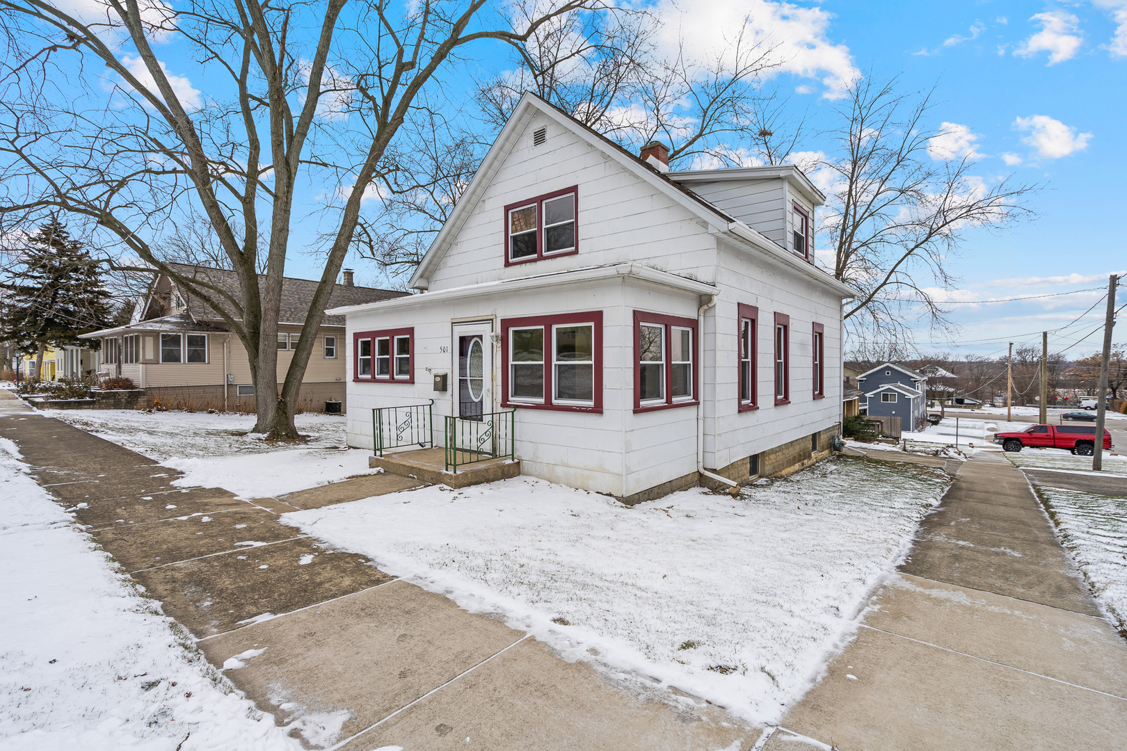 501 South Hamilton Street Lockport, IL 60441 - Photo 36 of 45 a front view of a house with a yard covered in snow