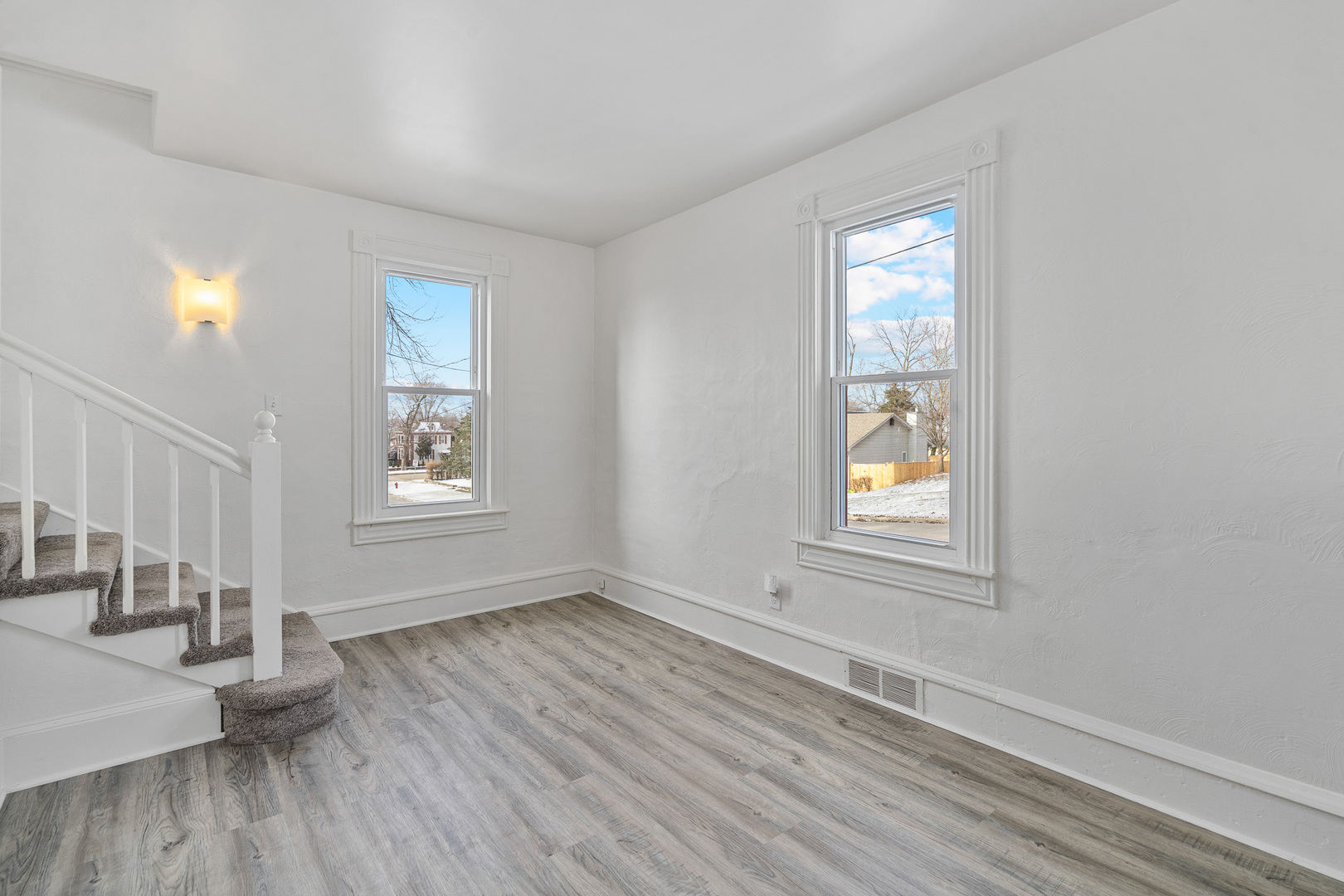 501 South Hamilton Street Lockport, IL 60441 - Photo 7 of 45 an empty room with wooden floor and windows