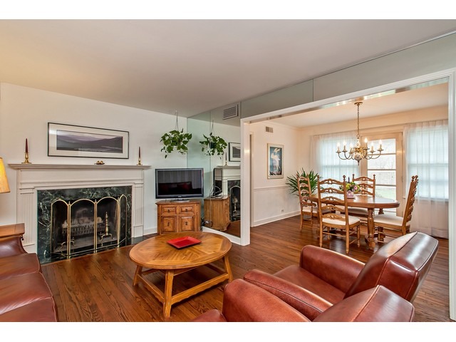 289 Wagner Road Northfield, IL 60093 - Photo 3 of 10 a living room with furniture and a fireplace