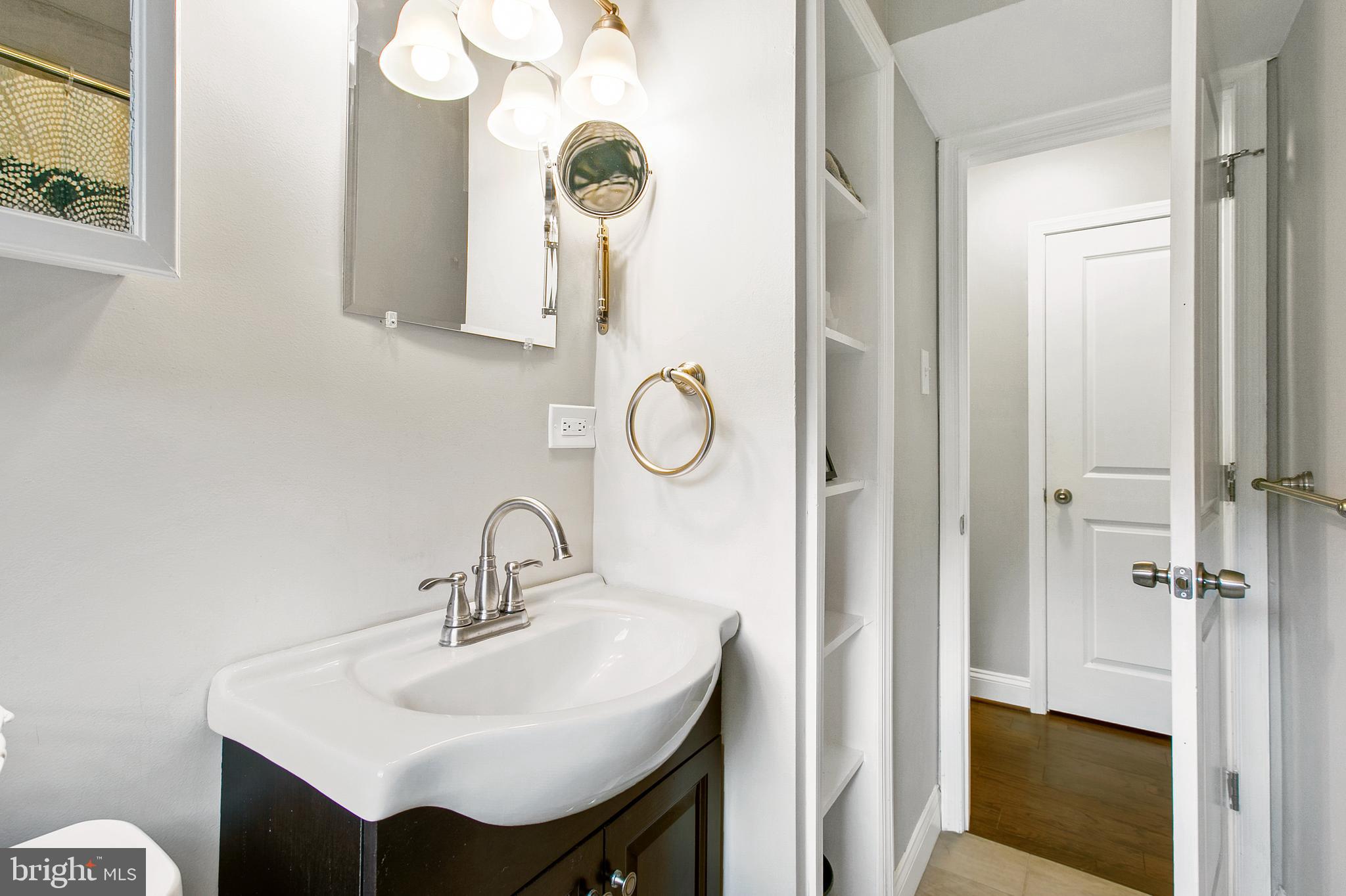 2930 Ridge Road Baltimore, MD 21244 - Photo 14 of 39 a bathroom with a sink and a mirror