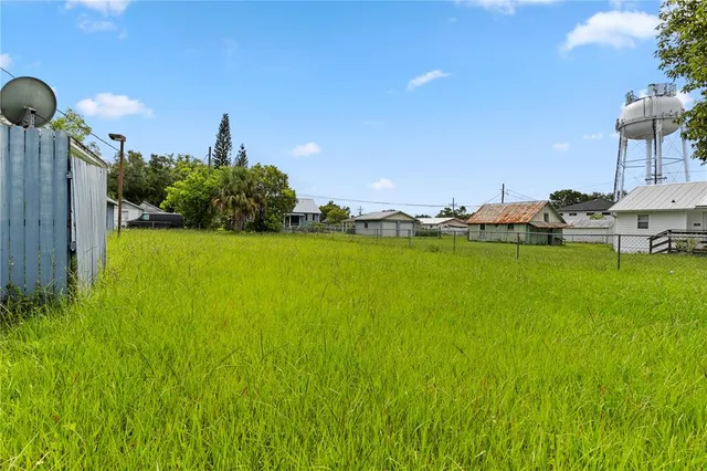 a view of a lake with lawn chairs