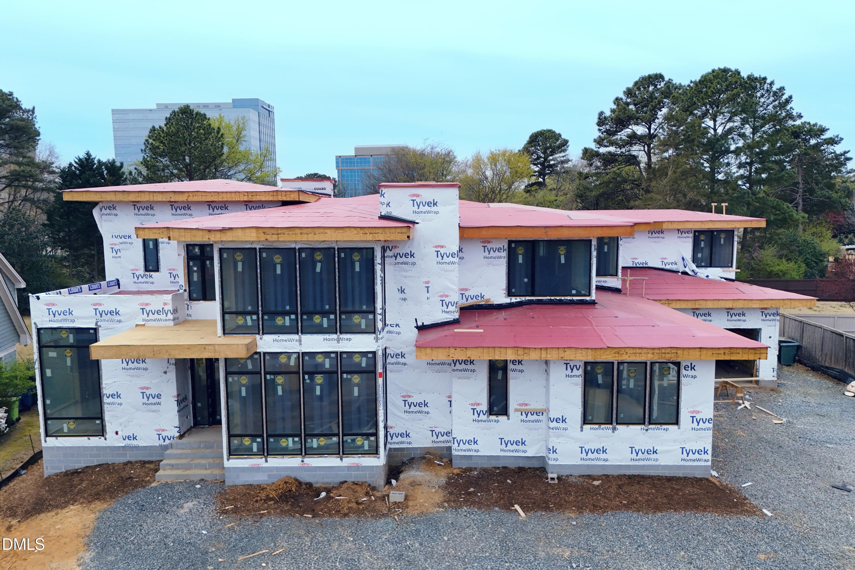 a view of a cafe with table and chairs next to a yard