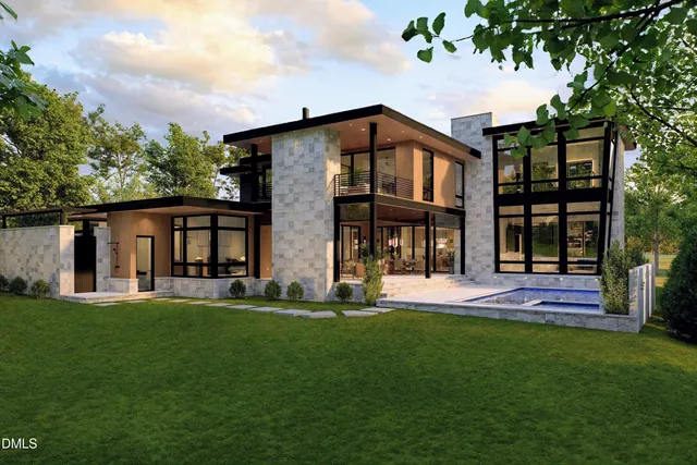 a view of a house with a yard and sitting area