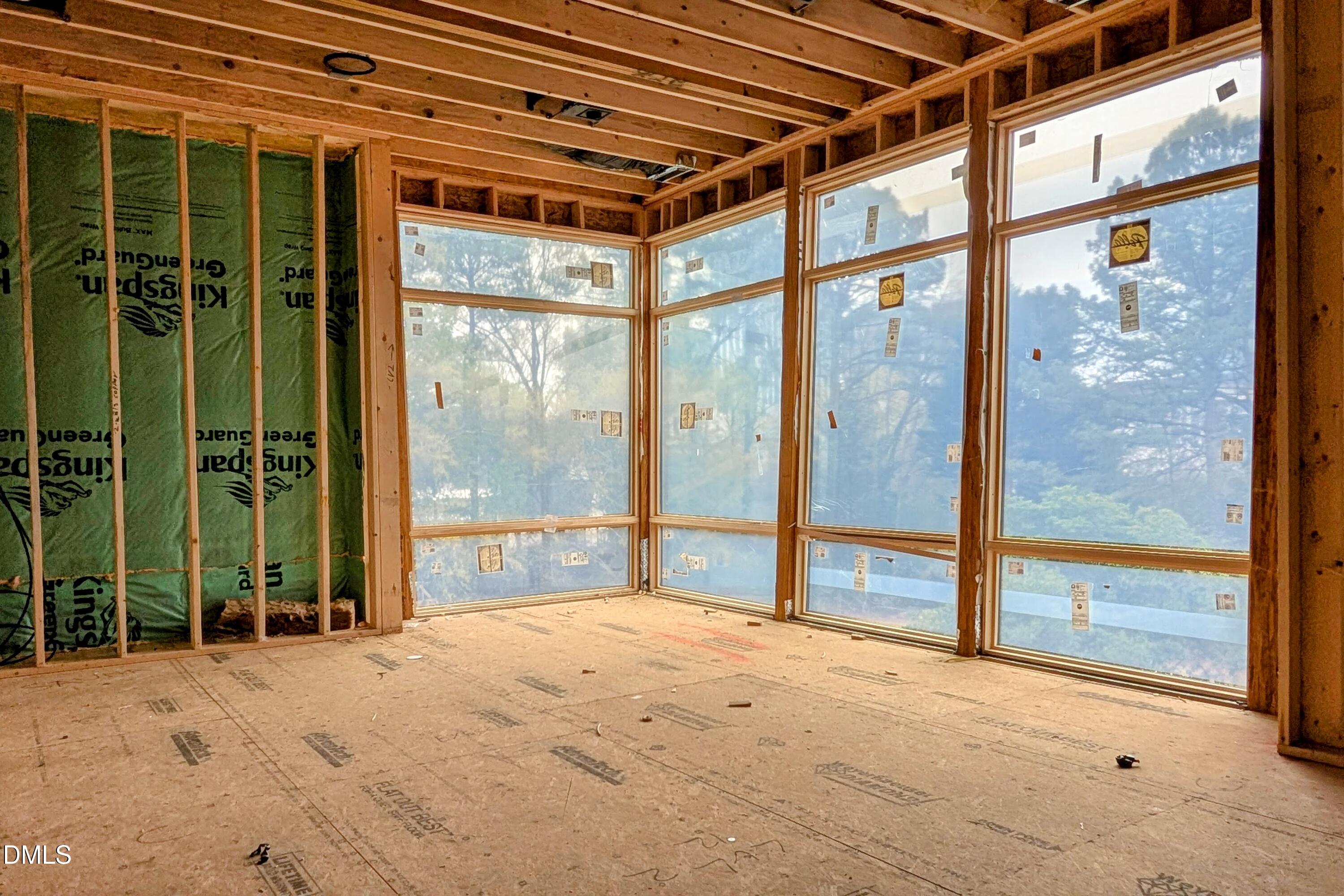 206 Lynwood Lane Raleigh, NC 27609 - Photo 12 of 33 a bedroom with a large window and a porch