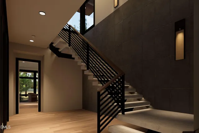 a view of a living room with furniture and a flat screen tv