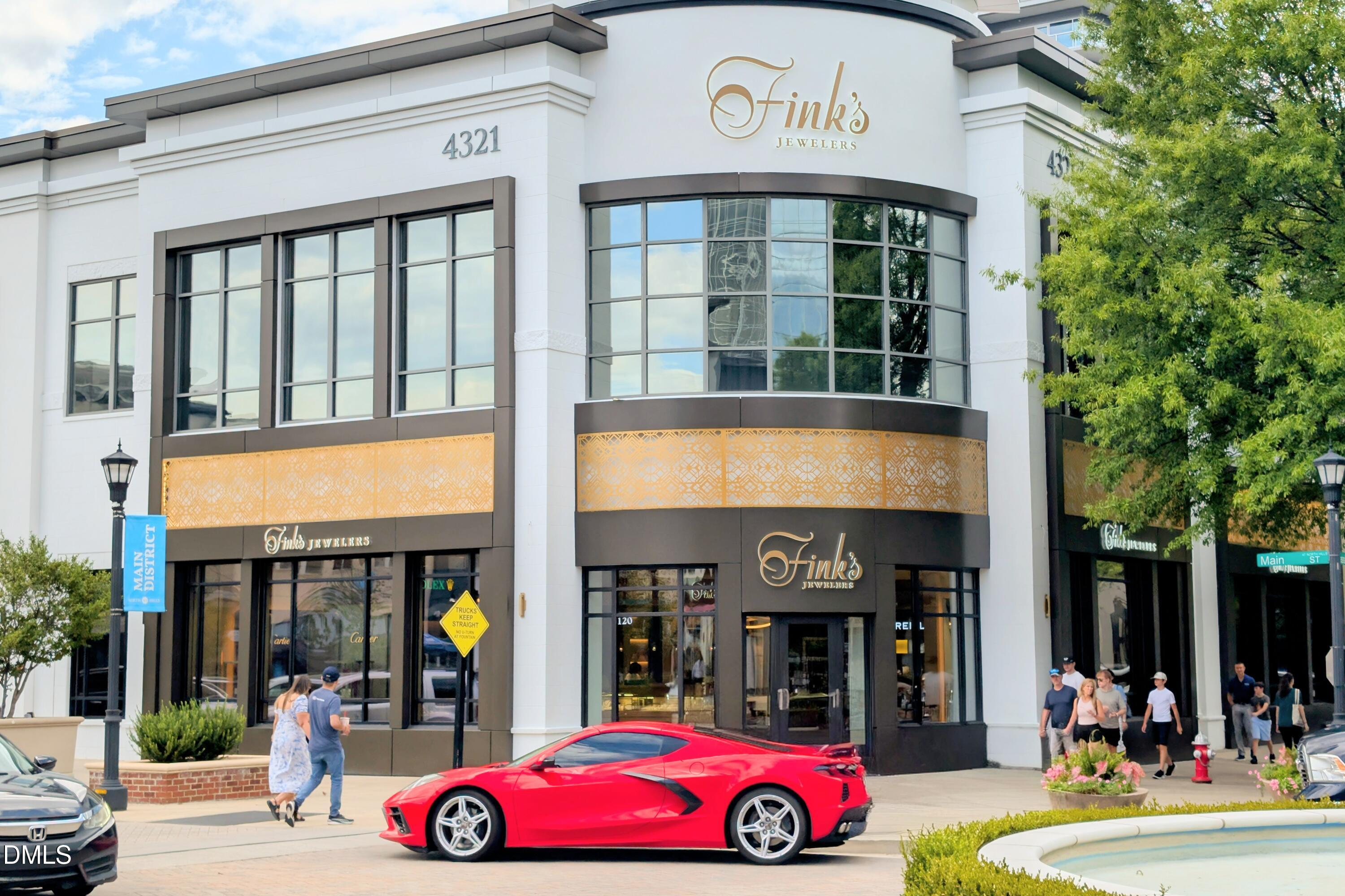 206 Lynwood Lane Raleigh, NC 27609 - Photo 30 of 37 a front view of a multi story building with retail shops
