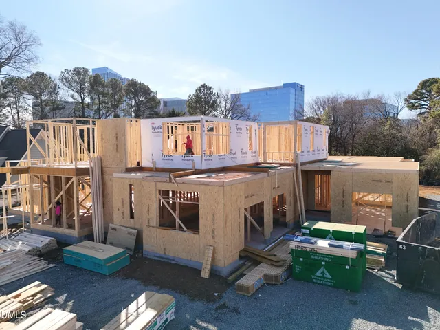 a view of a patio with iron fence