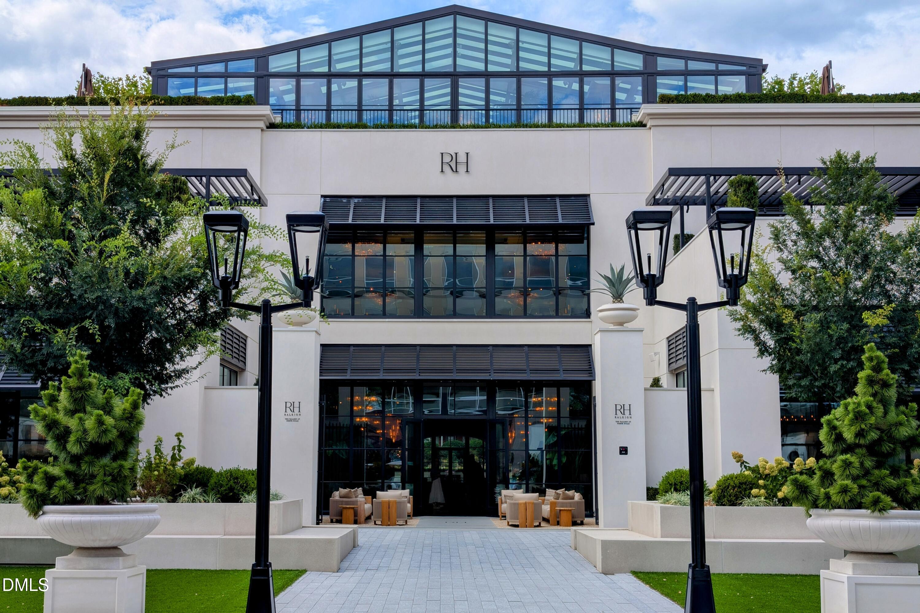 206 Lynwood Lane Raleigh, NC 27609 - Photo 31 of 33 a building with potted plants in front of it