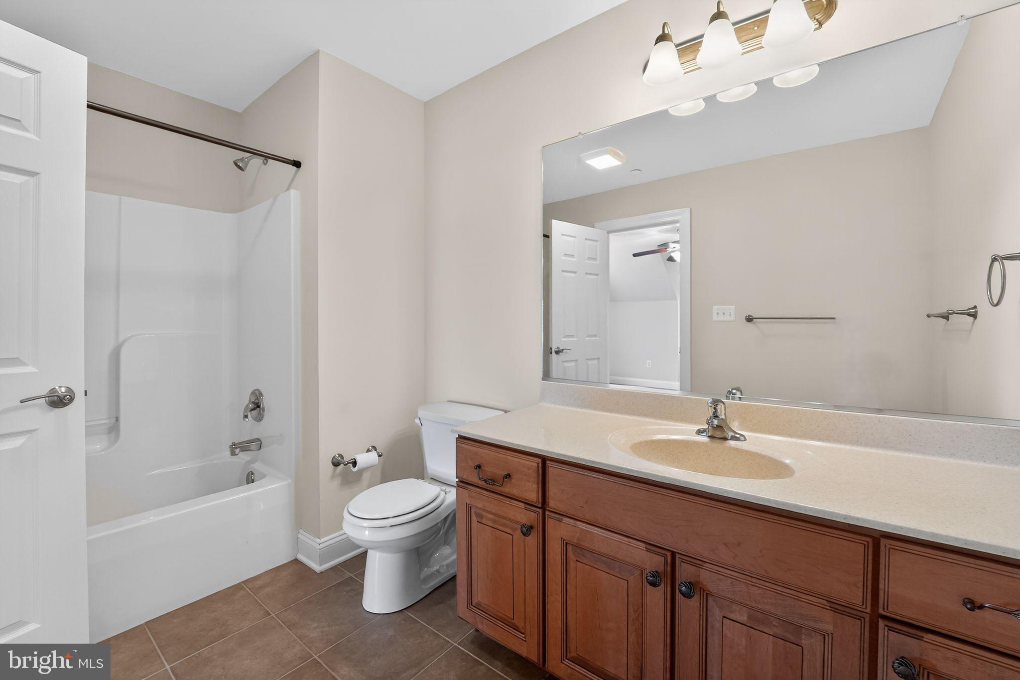 1165 Line Road Westminster, MD 21158 - Photo 33 of 75 a bathroom with a sink a toilet and a large mirror