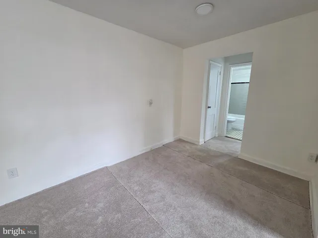 a view of an empty room and closet