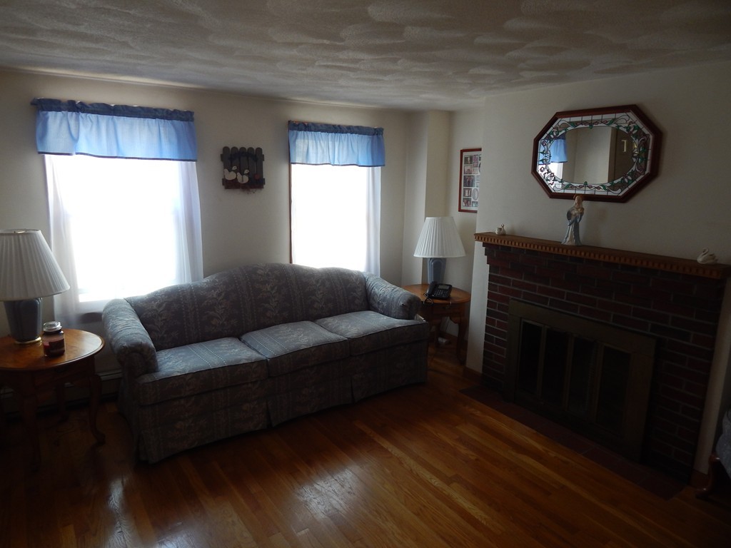 274 Athens Street Boston, MA 02127 - Photo 12 of 23 a living room with furniture and a window