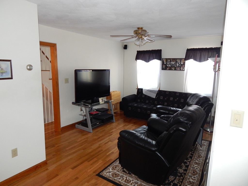 274 Athens Street Boston, MA 02127 - Photo 14 of 23 a living room with furniture and a flat screen tv