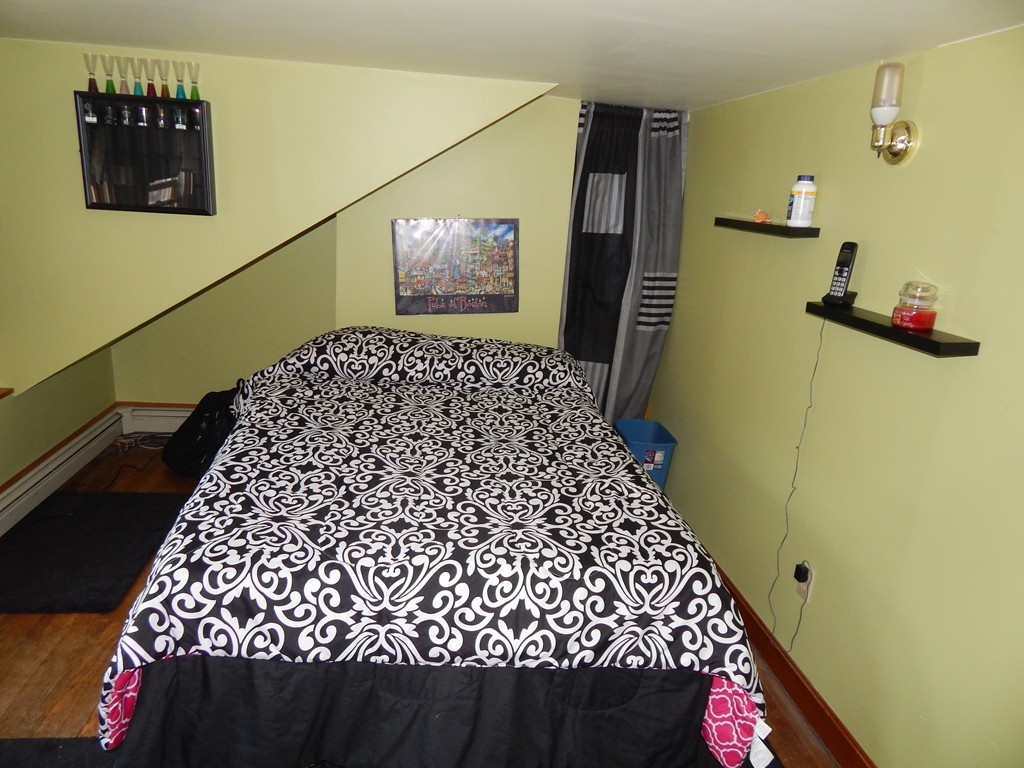 274 Athens Street Boston, MA 02127 - Photo 19 of 23 a bathroom with a bathtub and a shower