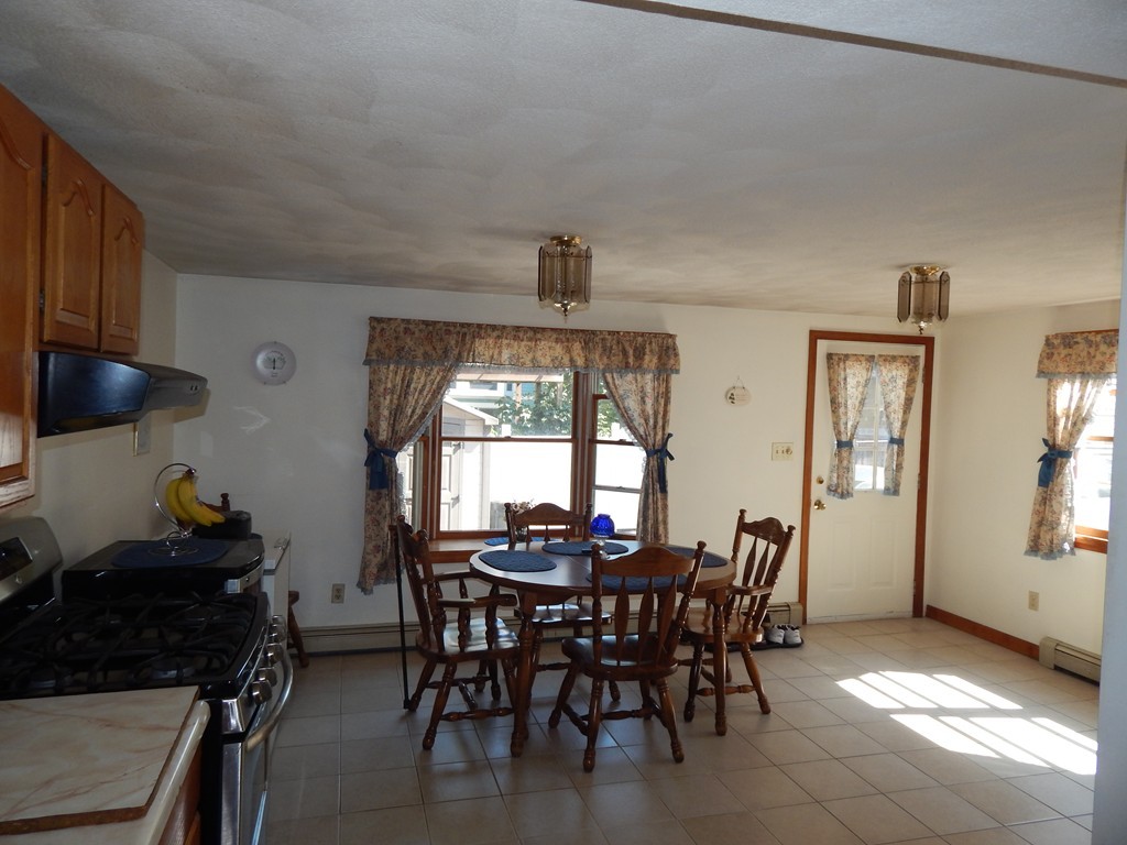 274 Athens Street Boston, MA 02127 - Photo 10 of 23 a view of a dining room with furniture and a window