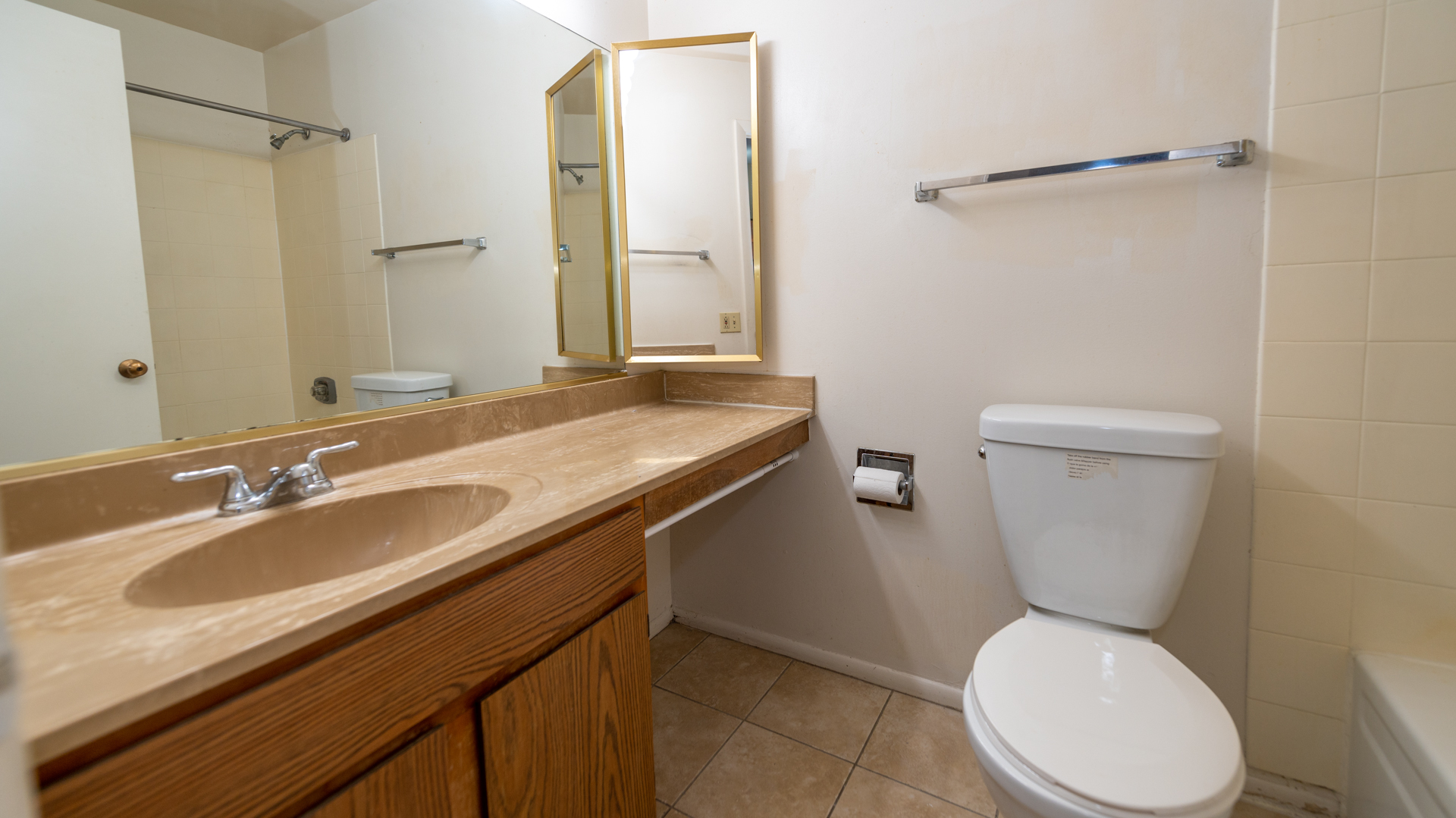 780 South Federal Street, Unit 1106 Chicago, IL 60605 - Photo 13 of 32 a bathroom with a granite countertop toilet sink and mirror