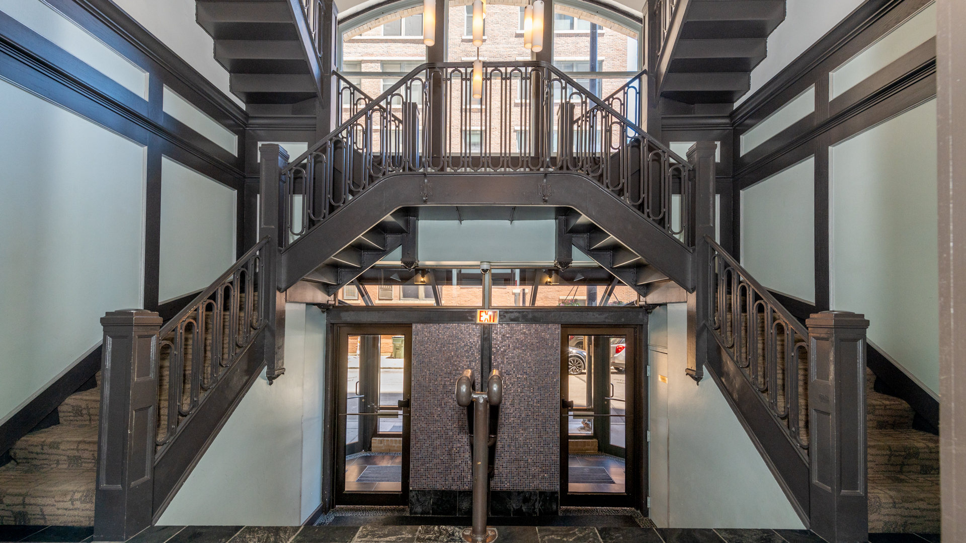 780 South Federal Street, Unit 1106 Chicago, IL 60605 - Photo 29 of 32 a view of staircase with lots of frames and wooden floor