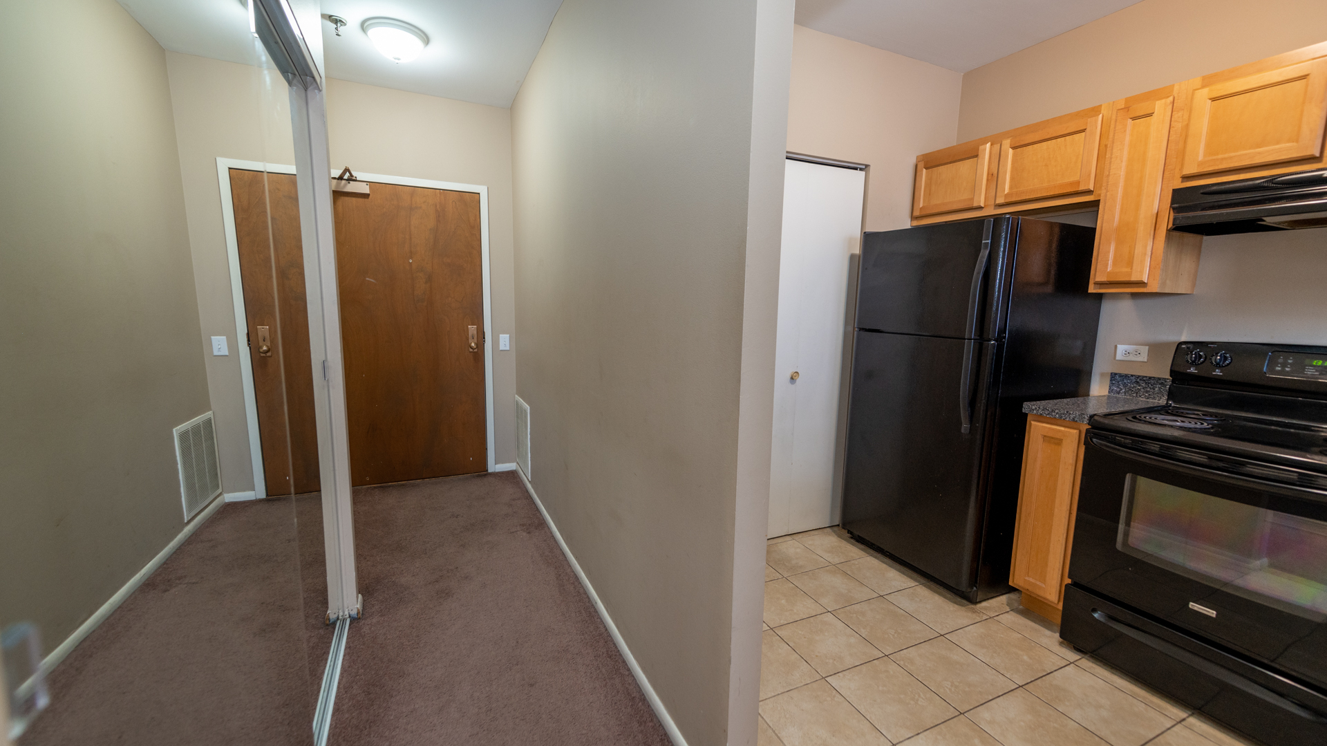 780 South Federal Street, Unit 1106 Chicago, IL 60605 - Photo 8 of 32 a kitchen with stainless steel appliances granite countertop a refrigerator and a stove