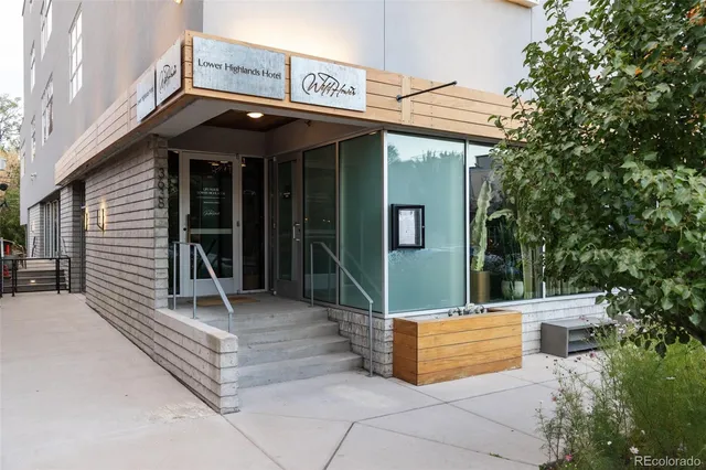 a view of a building with sitting area