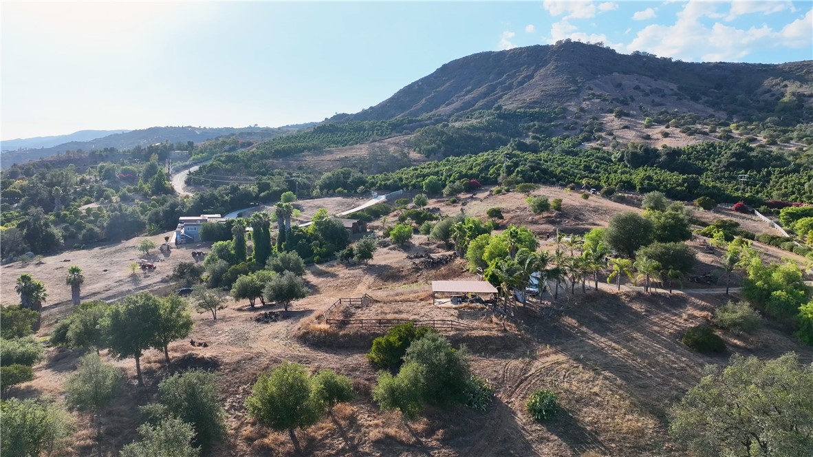 22735 Carancho Road Temecula, CA 92590 - Photo 5 of 17 a view of a lush green hillside and houses