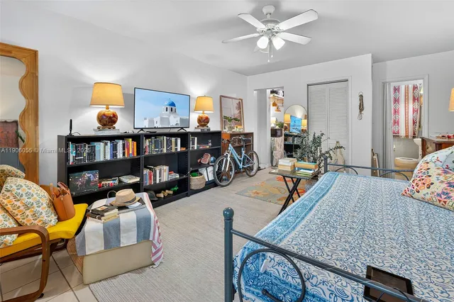 a bedroom with furniture and a chandelier