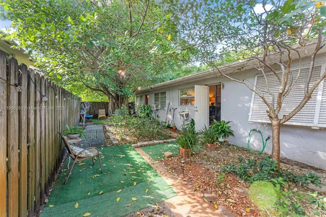 a backyard of a house with seating space