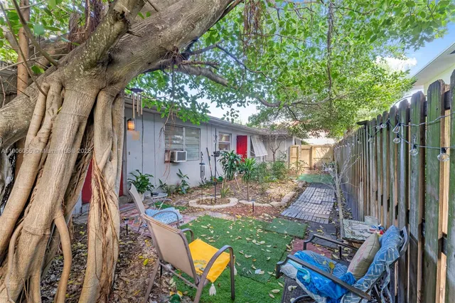 a backyard of a house with seating space