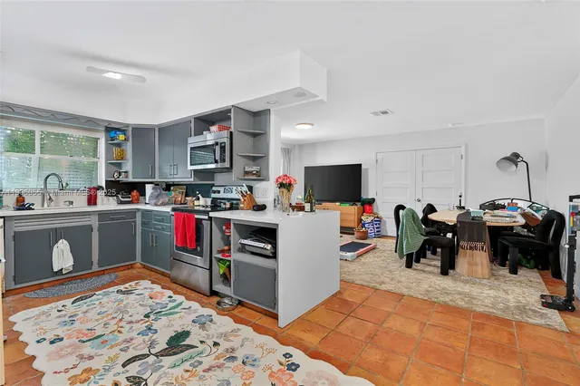 a bed room with a bed and a television