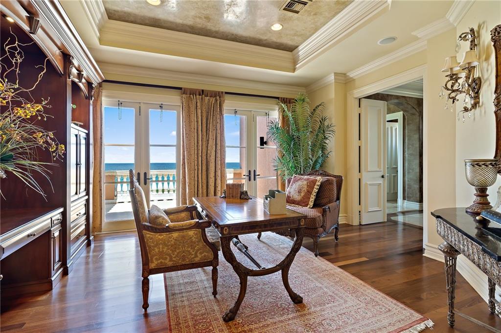 1025 Northeast Doubloon Drive Stuart, FL 34996 - Photo 11 of 69 a dining room with furniture and wooden floor