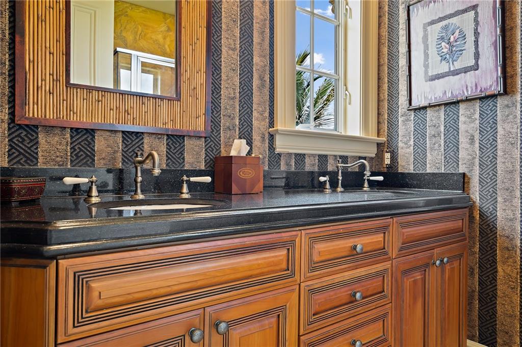 1025 Northeast Doubloon Drive Stuart, FL 34996 - Photo 22 of 69 a kitchen with stainless steel appliances granite countertop a sink and a window