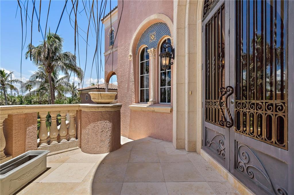 1025 Northeast Doubloon Drive Stuart, FL 34996 - Photo 3 of 69 a view of a entryway door of the house