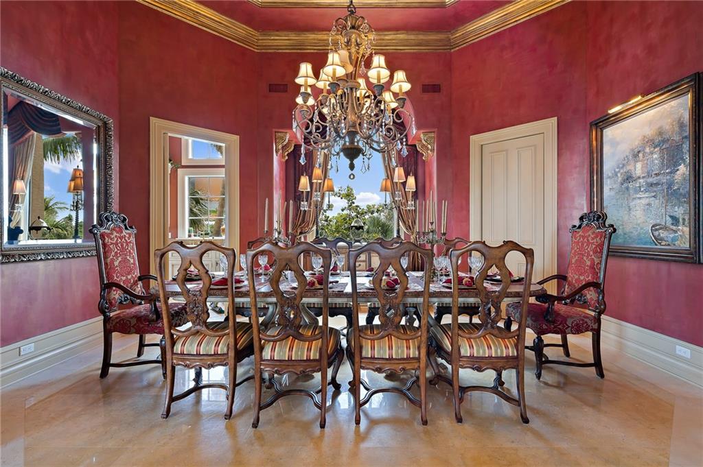 1025 Northeast Doubloon Drive Stuart, FL 34996 - Photo 33 of 69 a view of a dining room with furniture and chandelier